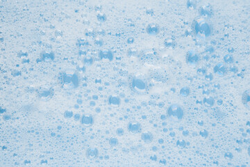 white soapy water on a blue background