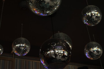 Disco balls on the ceiling. Interior with mirrored surface.