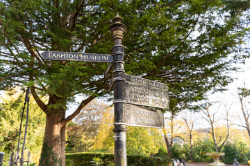 Vintage signpost in a leafy park