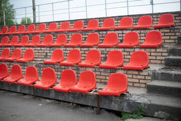 Sports stand. Empty seats in the stadium. Chairs in the stadium.