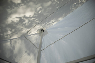 Tent construction. White tent. Tent roof. Mechanism for tensioning the fabric.