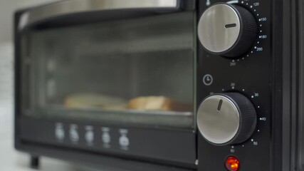 Anticipating Breakfast: Toaster Oven Ticks Before Delightful Bell Rings