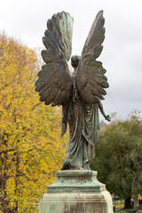 Angel statue in autumn park setting