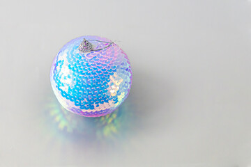 A shiny disco ball ornament with playful reflections