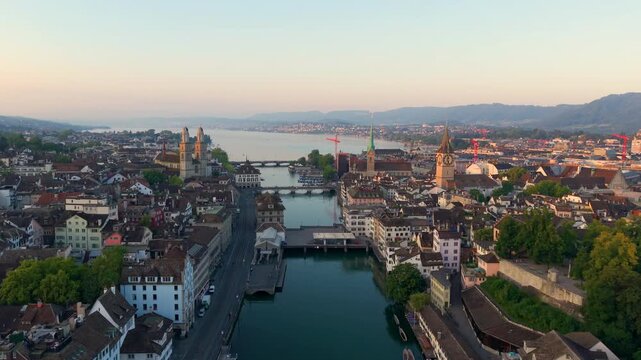 Aerial view of Zurich Cityscape at sunrise, showcasing architecture and city life. Switzerland