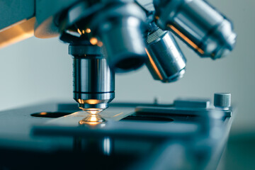 Detailed macro image of microscope objective with sterile laboratory lighting