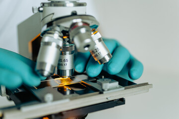 Macro image of microscope with illuminated specimen slide for research analysis