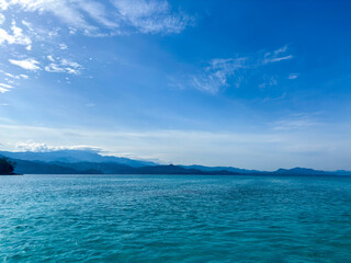 Discover stunning turquoise waters and captivating mountain views for your next travel campaign or scenic background