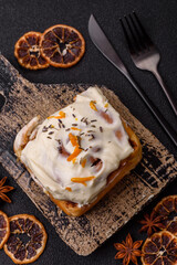 Cinnabon, a sweet cinnamon pastry, a high calorie bun or roll. Cinnabon with cinnamon
