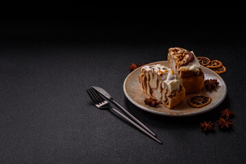 Cinnabon, a sweet cinnamon pastry, a high calorie bun or roll. Cinnabon with cinnamon