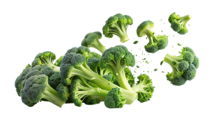 Fresh green broccoli florets scattered against a stark black studio background