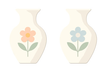 Two ceramic vases with simple pastel flower decorations standing next to each other