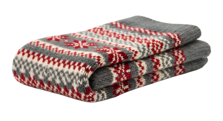 Warm folded blanket with a festive red and gray Nordic pattern, perfect for cozying up isolated on a transparent background