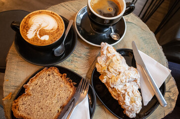 Coffee and pastries on rustic table