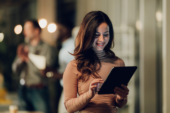 Young businesswoman using tablet with digital technology in office