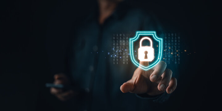 Cybersecurity concept showing a person touching a digital lock icon on a virtual screen, symbolizing data protection, internet security, privacy, and online information safety.