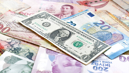 Money currencies banknotes. Different banknote Euro Thai Bath Bahraini Dinar Saudi Riyal United States Dollar Turkish Lira background.