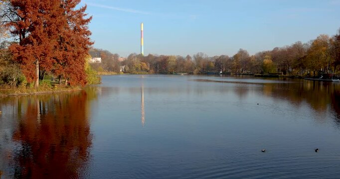 Part of the calm waters of the pond in the public park of Chemnitz during a clear autumn day.