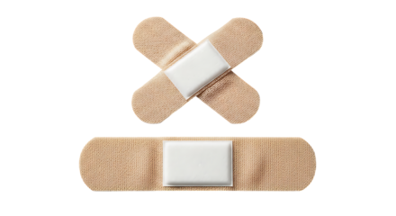 Beige medical adhesive plasters in a strip and cross shape for wound care and treatment