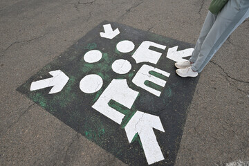 Person standing by unusual signage.