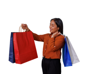 Happy woman holding multiple colorful shopping bags, feeling joy from retail therapy and consumer spending on transparent background
