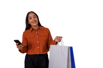 Happy young woman holding shopping bags and mobile phone, smiling, enjoying online shopping, consumerism concept