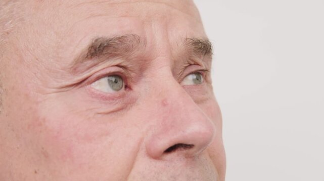 Close up mature senior man, fatigue syndrome eye Asthenopia, eye pain symptoms, including strain, allergies, blocked duct, severe eye conditions, corneal ulcers, glaucoma or acute angle-closure