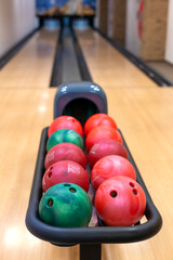 Bowling center with lanes and colorful bowling balls. Entertainment center. Board game