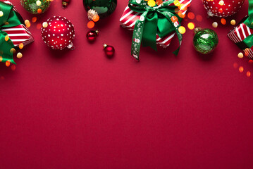 Merry Christmas and Happy Holidays greeting card, frame, banner. New Year. Red Christmas ornaments...