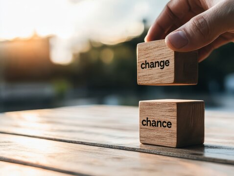 Transformative change a hand flipping wooden cubes in a warm outdoor setting
