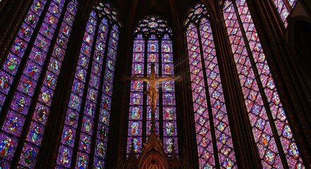 Sunlight streams through a massive, ornate stained glass window, illuminating the towering arches and peaceful pews of a majestic, sacred cathedral ,ceiling ,sunlight ,light