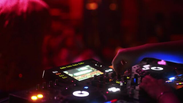 dj mixer in action close up low light	