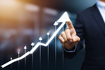 Businessperson pointing at a glowing upward arrow graph symbolizing growth and success.