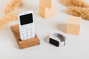 Wireless communication between a push-button telephone and a fitness bracelet