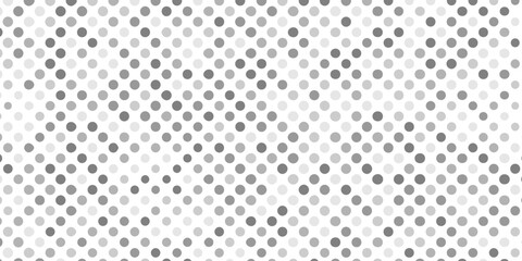 Abstract halftone pattern of varying gray circles on creating artwork featuring overlapping circles of textured pattern background, halftone with mix shades of gray and white dots modern background.
