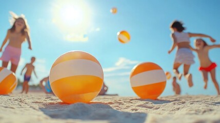 Children playing on sunny beach with colorful beach balls in summer