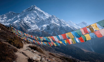 Buddhist Prayer Flags Fluttering Over Snowy Peaks