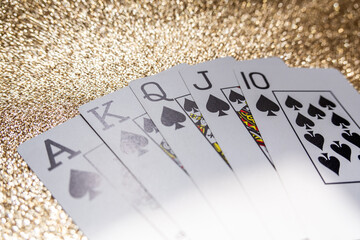 Photograph of a set of cards that make a winning hand, a Royal Flush