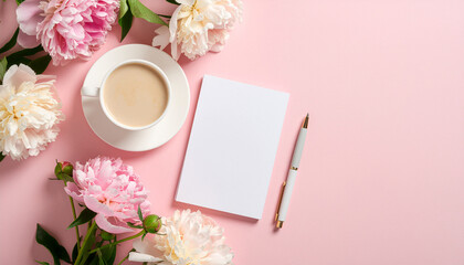 Cup of coffee with flowers, notebook and pen on pink background