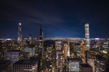 Night panoramic view of Midtown Manhattan with illuminated skyscrapers and Central Park in the...