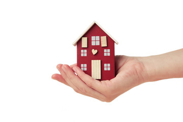 Hands with wooden toy house isolated on white background. Rent concept