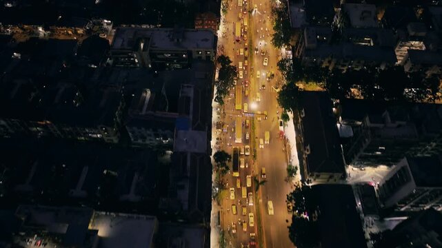 Cinematic aerial view of Mumbai's downtown night scene. Central Mumbai's cityscape and skyline- Lalbaug-Parel, Worli, Prabhadevi. beautiful modern buildings, bright glowing lights, and roads.