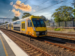 Obraz premium Passenger Train going through Summer Hill train station a suburban Sydney train Station NSW Australia
