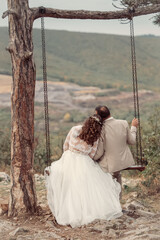 Wedding emwedding, wedding couple, romantic, relationship, couple, romance, together, swing, love, in love, husband, groom, embracing, wedding day, autumn, joy, beautiful, bridbracing in love on swing