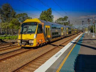 Naklejka premium Passenger Train going through Summer Hill train station a suburban Sydney train Station NSW Australia