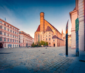 Incredible summer view of empty Minoritenplatz square. Spectacular morning view of Wiener Minoritenkirche Catholic church. Picturesque cityscape of Vienna town, Austria. Traveling concept background.