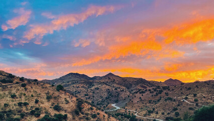 Rolling landscape with hills and olive trees during sunset in countryside of Malaga, Andalucia, Spain.
