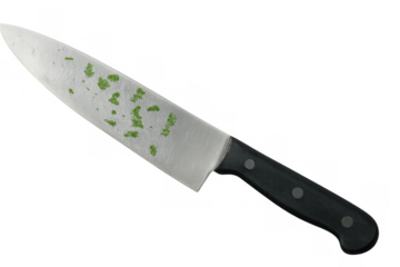 Chef's knife blade with fresh chopped herbs for cooking, food preparation and healthy recipes, transparent background