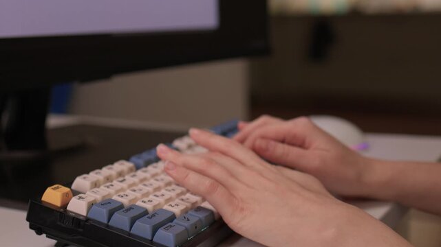 Hands input data swiftly, Closeup of fingers editing spreadsheet details, Person rapidly typing on vibrant keyboard while managing data on colorful digital display