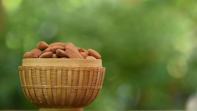 Almond seeds on natural background.